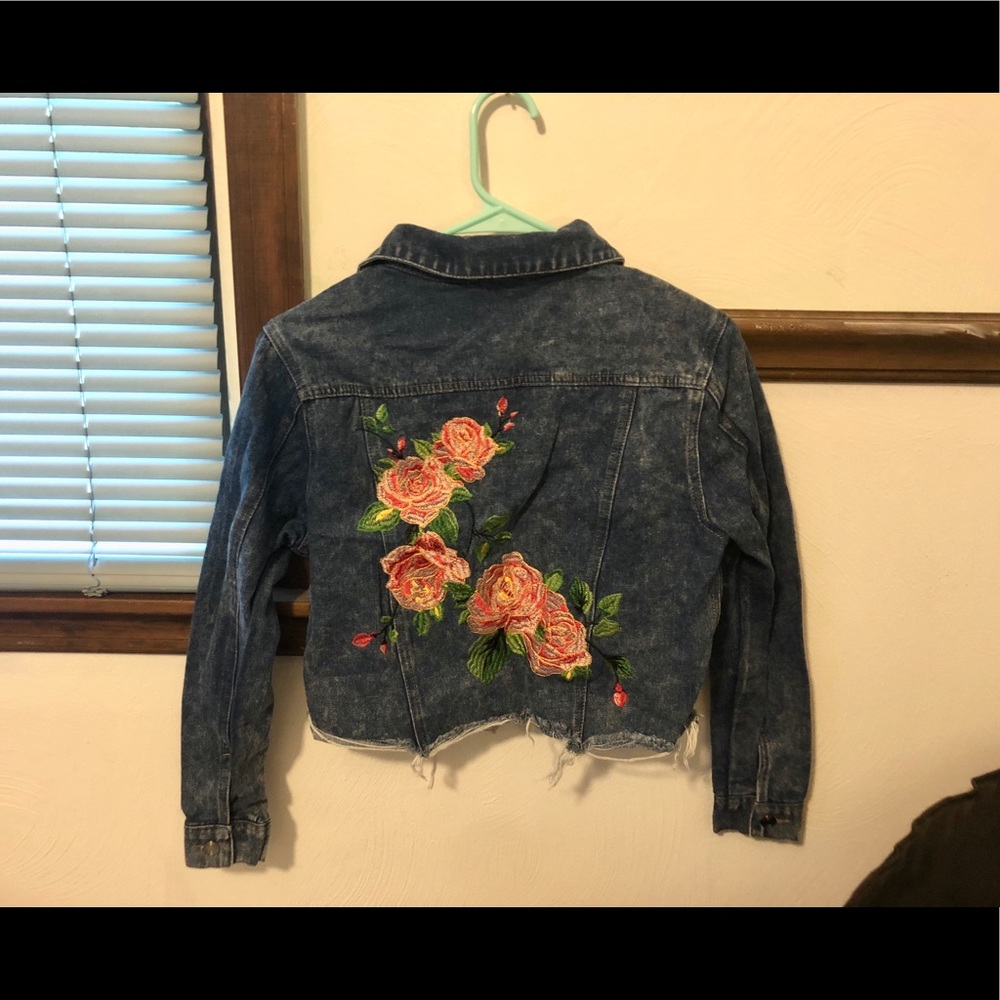 Denim jacket with embroidered flowers on back